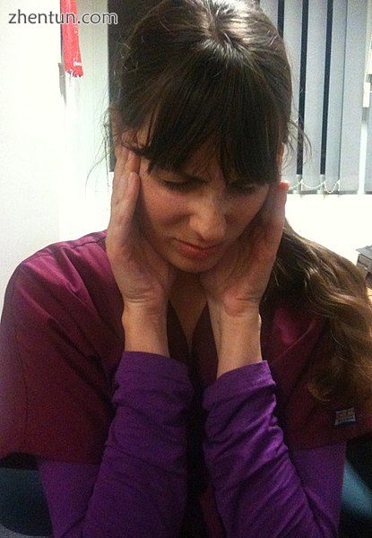 A woman experiencing a tension headache.jpg
