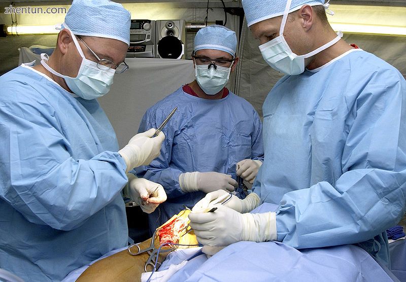 Surgeons repairing a ruptured Achilles tendon on a man.jpg