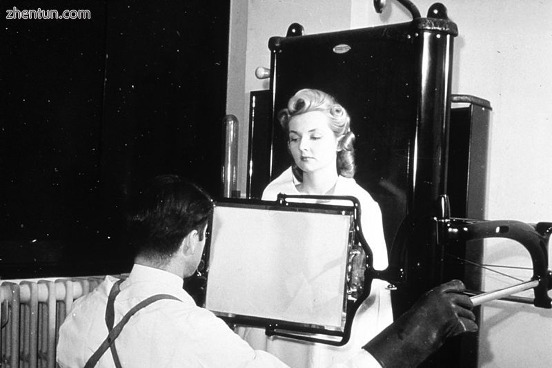 A patient being examined with a thoracic fluoroscope in 1940, which displayed co.jpg
