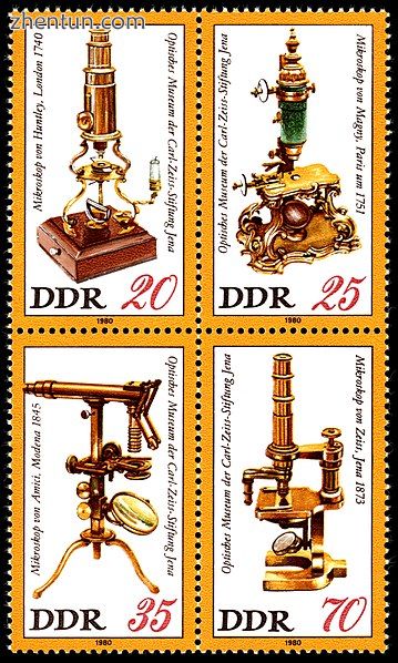 East German postage stamps depicting four antique microscopes. Advancements in m.jpg