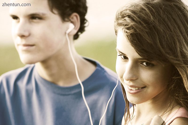 Two adolescents listening to music.jpg