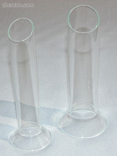 Two cylindrical-shaped glass specula.jpg