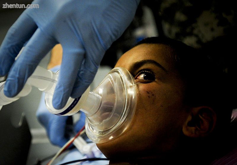 A child being prepared to go under anesthesia.jpg