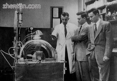 Dr. John P. Merrill (left) explains the workings of.jpg