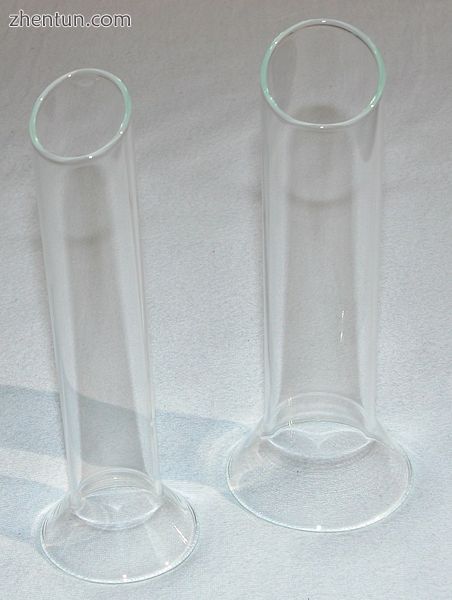 Two cylindrical-shaped glass specula.jpg