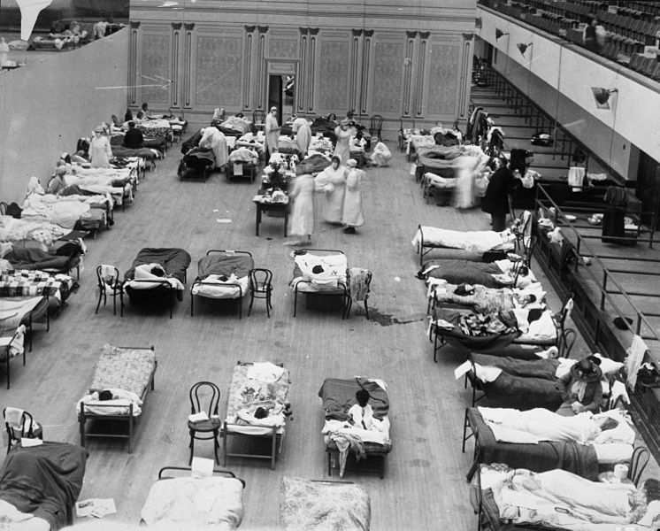 American Red Cross nurses tend to flu 病人 in temporary wards set up inside .jpg